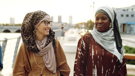 Young-Muslim-Women-Walking-on-Embankment